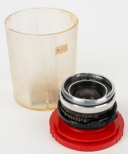 CARL ZEISS: Circa 1970 Carl Zeiss Skoparex 35mm f3.4 lens [#7357262] with Icarex screw mount in maker's plastic dome.