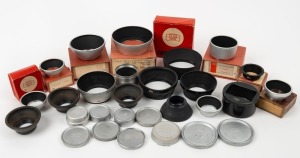 ZEISS IKON: Twenty-eight photography accessories of various diameters (eight of which in maker's boxes), comprising eleven metal lens hoods, seven rubber or plastic lens hoods, and ten lens caps with such inscriptions as 'Zeiss Opton', 'Zeiss Ikon', and '