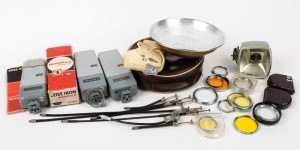 ZEISS IKON: Twenty-six accessories, comprising seven shutter release cables ranging in length from 7-23cm, fourteen lens filters representing eleven different designations, and five flash units. (26 items)