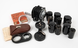 ZEISS IKON: Eight accessories - one Ikoprox close-up lens in leather case, one 1630/2 tilting tripod head, one 1527 adapter ring in maker's box, two 540/01 film cassettes in angular plastic cases, and three film cassettes in round plastic cases. (8 items)