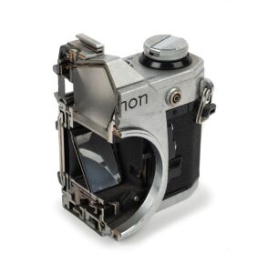 CANON: Circa 1976 Canon AE-1 camera body [#101862] vertical half cutaway model.