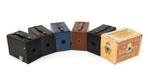 KODAK: Six different c. 1910s No. 2 Brownie box cameras - one black Model E in maker's box with instruction booklet, one Model F with fine-grained blue covering, one Model F with fine-grained green covering, one Model F with fine-grained black covering, one Model F with brown leatherette covering, and one Model F with pebble-grained black covering. (6 cameras)