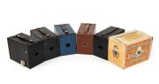KODAK: Six different c. 1910s No. 2 Brownie box cameras - one black Model E in maker's box with instruction booklet,&nbsp;one Model F with fine-grained blue covering, one Model F with fine-grained green covering, one Model F with fine-grained black covering, o