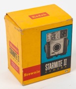 KODAK: Seven 127 rollfilm cameras - one c. 1939 Baby Brownie Special, one c. 1946 Brownie Reflex with maker's box, one c. 1953 Brownie 127, one c. 1957 Brownie Bullet, one c. 1957 Brownie Starflash, one c. 1962 Brownie Fiesta, and one c. 1962 Brownie Star - 4