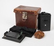 NAGEL: Recomar 18 folding plate camera, c. 1928, with Xenar 105mm f4.5 lens [#438187] and Compur shutter, together with leather case containing black hood cloth, wrist strap, camera back, and six metal film holders. - 4