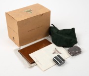 MINOLTA: Minolta Prod-20's retro-design 35mm compact camera [#33865], c. 1990, with Minolta 35mm f4.5 lens and metal lens cap. Maker's box with suede pouch, wrist strap, and printed matter also present. - 6