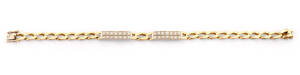 BRACELET: 18ct gold and diamond flattened curblink bracelet. 9 grams.