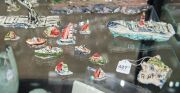 ROBERT RAPSON (New Zealand) painted and glazed ceramic shipping sculptures, (19 pieces), most signed, the ship 42cm long - 5