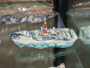 ROBERT RAPSON (New Zealand) painted and glazed ceramic shipping sculptures, (19 pieces), most signed, the ship 42cm long - 7