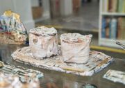 ROBERT RAPSON (New Zealand) painted and glazed ceramic shipping sculptures, (19 pieces), most signed, the ship 42cm long - 8