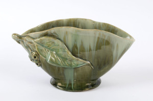 REMUED fan shaped pottery vase with applied gumnuts, branch and leaf glazed in green and cream, incised "Remued" with shape code, 12cm high, 22cm wide