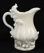 CHELSEA Blanc de Chine strawberry jug and two handled coffee cup, circa 1745, (2 items), impressed triangular mark to the base of the jug, 14cm high - 6