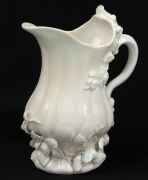 CHELSEA Blanc de Chine strawberry jug and two handled coffee cup, circa 1745, (2 items), impressed triangular mark to the base of the jug, 14cm high - 8