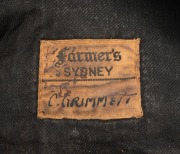 CLARRIE GRIMMETT'S AUSTRALIAN BAGGY GREEN CAP dated 1935-36, for the tour of South Africa, November 1935 to March 1936; green wool with the coat of arms embroidered with gold and silver wire and coloured thread; with the embroidered label of "Farmers SYDN - 3