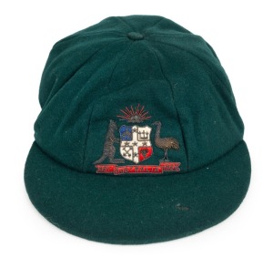CLARRIE GRIMMETT'S AUSTRALIAN BAGGY GREEN CAP dated 1931-32, Test Match Series against South Africa in Australia, November 1931 to February 1932; green wool with the coat of arms embroidered with gold and silver wire and coloured thread; with the embroidered label of "FARMERS SYDNEY" inscribed in ink, "C.GRIMMETT".