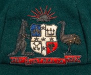 CLARRIE GRIMMETT'S AUSTRALIAN BAGGY GREEN CAP dated 1931-32, Test Match Series against South Africa in Australia, November 1931 to February 1932; green wool with the coat of arms embroidered with gold and silver wire and coloured thread; with the embroide - 2