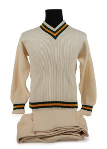 An Australian Cricket Team woollen jumper with printed "Farmers Sydney" label with "C. GRIMMETT" in pen; together with a pair of cricket flannels by Kaylo, with a "GRIPU" waistband label. (2, both appear to be in unworn condition).Provenance: The Clarrie 