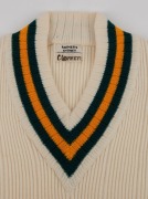 An Australian Cricket Team woollen jumper with printed "Farmers Sydney" label with "C. GRIMMETT" in pen; together with a pair of cricket flannels by Kaylo, with a "GRIPU" waistband label. (2, both appear to be in unworn condition).Provenance: The Clarrie - 3