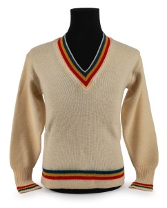 CLARRIE GRIMMETT'S SOUTH AUSTRALIAN TEAM, circa 1930 woollen jumper with blue, yellow and red colours to cuffs and collar; "Australknit S.A." maker's label, "The Big Store John Martin's Mens & Boys Outfitters Adelaide" retailer's label and ownership label