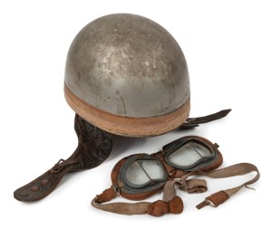 BOB McINTYRE (1928-1962), early 1950s motor cycle racing helmet (by Cromwell), with leather strap and studs. Accompanied by a pair of WWII surplus aviation goggles, which is what the motor cyclists used at the time. (2 items).
