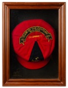 CLARRIE GRIMMETT'S ADELAIDE CRICKET CLUB "1905 - 2005 TEAM OF THE CENTURY"&nbsp; award cap, red wool with the club coat-of-arms to the front panel, Grimmett's name as "cap" number "122" with explanatory sash embroidered to the crown; attractively presented in 