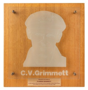 CLARRIE GRIMMETT'S AUSTRALIAN CRICKET HALL OF FAME ETCHED GLASS PLAQUE, with affixed metal plaque below bearing the dedication "Presented to the family of CLARRIE GRIMMETT on the occasion of his induction into the Australian Cricket Hall of Fame at the Me