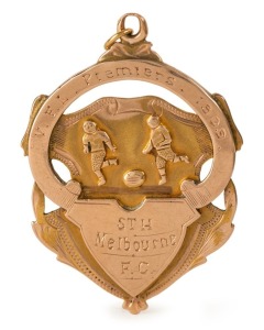 V.F.L. PREMIERS 1909 SOUTH MELBOURNE FOOTBALL CLUB. 15ct gold medallion fob, 7.3 grams; engraved verso  "Presentd by A. McCRACKEN Esq., Presd't - to C.E. WADE."