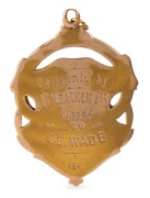 V.F.L. PREMIERS 1909 SOUTH MELBOURNE FOOTBALL CLUB. 15ct gold medallion fob, 7.3 grams; engraved verso  "Presentd by A. McCRACKEN Esq., Presd't - to C.E. WADE." - 2