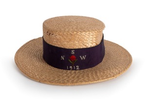 A New South Wales rugby union straw boater with navy headband embroidered with "N.S.W", "1912" and the state waratah flower.