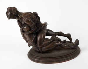 Artist Unknown, resin sculpture depicting a dramatic tackle, inscribed to base "ENGRIS AUSTRALIA, c 2003", 43cm long.