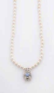PEARL CHOKER: The double strand necklace hung with a diamond and sapphire clasp.18ct yellow gold.