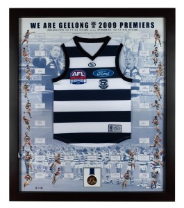 GEELONG CATS: 2009 Premiership display featuring a commemorative Grand Final jersey surrounded by photographs of all team members and their original signatures (23 total); complimented by a replica Premiership medal. AFL official limited edition 63/200. Framed and glazed, overall 126 x 117cm.