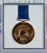 GEELONG CATS: 2009 Premiership display featuring a commemorative Grand Final jersey surrounded by photographs of all team members and their original signatures (23 total); complimented by a replica Premiership medal.&nbsp; AFL official&nbsp;limited edition 63/200.&nbsp; - 2