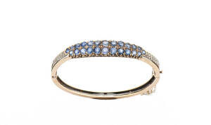 BANGLE: Yellow and white gold sapphire and diamond. 18.66 grams.