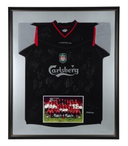 LIVERPOOL FOOTBALL CLUB: Away jersey, signed by 30 members of the 2005 squad. Attractively framed and glazed together with a team photo. Accompanied by Certificate of Authenticity, dated 2005. Overall, 101 x 83cm.
