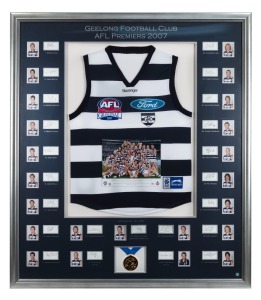 GEELONG CATS: 2007 Premiership display featuring a commemorative Grand Final jersey surrounded by photographs of all team members and their original signatures (23 total); complimented by a replica Premiership medal and A-tag certification number 03018236