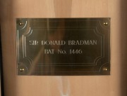 SIR DONALD BRADMAN portrait bat, signed by Bradman, with a numbered plaque (No.1446) affixed; attractively presented in a custom-made display case with details of Bradman's career. Accompanied by a Certificate of Authenticity. - 2