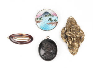 VARIOUS: Victorian jet cameo carved locket; two Japanese brooches and a hairclip.
