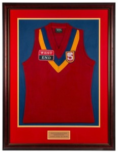 South Australian State Representative guernsey worn by Nathan Buckley while representing the SANFL in a game against the WAFL played on May 12 1992. Framed & glazed.This was not a State of Origin contest but a game played between representative sides from