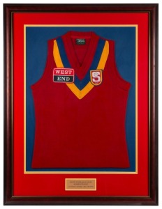 South Australian State Representative guernsey worn by Nathan Buckley while representing the SANFL in a game against the WAFL played on May 12 1992. Framed & glazed.This was not a State of Origin contest but a game played between representative sides from the respective Leagues. South Australia won the game by a goal, with Buckley named second best player behind captain Garry McIntosh (Tony Modra and Michael Aish were other notables in the side). Together with his red SA socks from the same