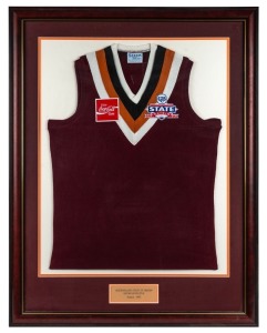 Queensland guernsey worn by Nathan Buckley when he played for Queensland in the 1993 State of Origin series. Framed & glazed. This was the first tournament to combine Territory with State teams, and Queensland was combined with the Northern Territory. Queensland–Northern Territory ultimately defeated Tasmania in the Section 2 final, giving Queensland its first ever tournament success. Together with a pair of plain maroon Queensland socks worn by Buckley in the same series.
