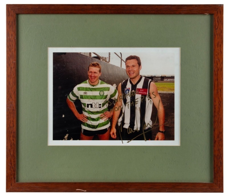 Framed photo of Nathan Buckley and soccer star Mark Viduka, with Nathan Buckley in Celtic shirt and Viduka in Collingwood jumper. Endorsed by Viduka to Nathan Buckley with message “To Nathan, C’Mon the Pies!” circa1999