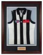 Nathan Buckley’s Collingwood guernsey circa 2000. With plaque attached reading: ‘COLLINGWOOD FOOTBALL CLUB Played since 1994. Captain since 1999. Copeland Trophy Winner 1994, 1996, 1998, 1999, 2000.’ A framed presentation created at the conclusion of the