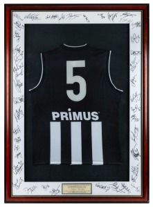 150th COLLINGWOOD GAME: The guernsey worn by Nathan Buckley in his 150th game for Collingwood, v North Melbourne at Docklands Stadium in May 2001; framed and glazed. Signed on the mount by 2001 Collingwood players. Plaque at bottom that reads: “The President, members and staff of the CFC would like to congratulate Nathan Buckley on the outstanding achievement of playing 150 AFL games for Collingwood.”