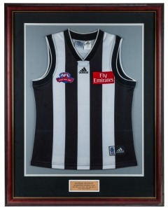 Nathan Buckley’s 2002 Grand Final guernsey. The guernsey worn by Buckley in the 2002 Grand Final against the Brisbane Lions. Buckley won the Norm Smith Medal for best on ground, despite his team losing the game. This has only happened on three other occasions in VFL/AFL history. Attractively framed and glazed.