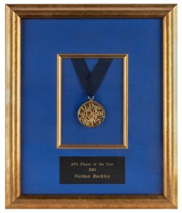 The Lou Richards medal, presented to Nathan Buckley for being judged ‘Player of the Year’ in 2003. The Lou Richards Medal is presented by Channel Nine’s Sunday Footy Show to the player voted by its panellists as the most valuable of the season. Framed & g