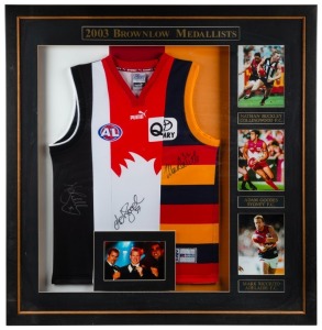 Brownlow Medal 2003. Composite guernsey created from Collingwood, Adelaide and Sydney guernseys, to commemorate the 2003 Brownlow Medal that was tied between Nathan Buckley, Mark Ricciuto and Adam Goodes. Signed by each winner, with a small photo of each. Believed to be one of only three created.