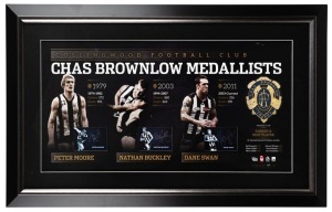 Framed lithograph signed by Collingwood’s three living Brownlow Medallists, circa 2012 – Dane Swan, Peter Moore and Nathan Buckley. The display comprises of a single image of each player, plus a replica Brownlow Medal. Signed by all three players. Limited