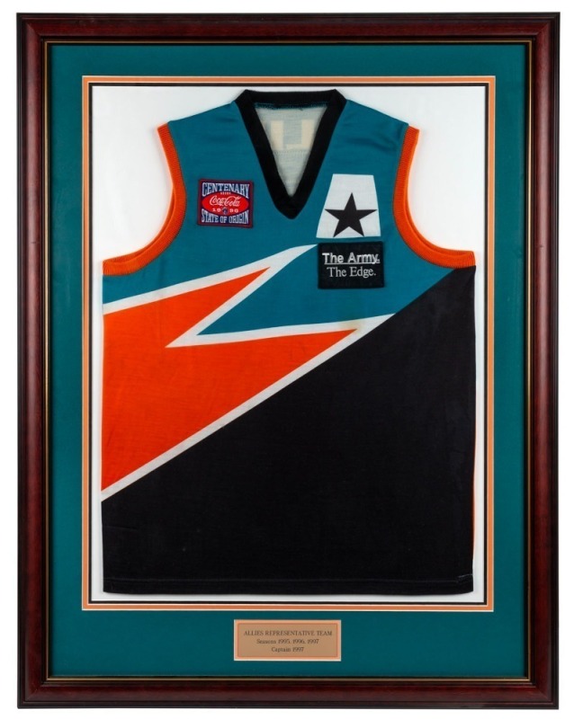 Nathan Buckley’s Allies guernsey worn while playing for the Allies in 1996 and 1997. Framed & glazed.Buckley was captain of the team in 1997.