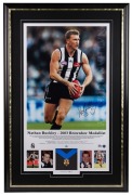 “Nathan Buckley – 2003 Brownlow Medallist”, framed & glazed display, with replica Brownlow Medal. Signed by Buckley. Limited edition #36 of 250.